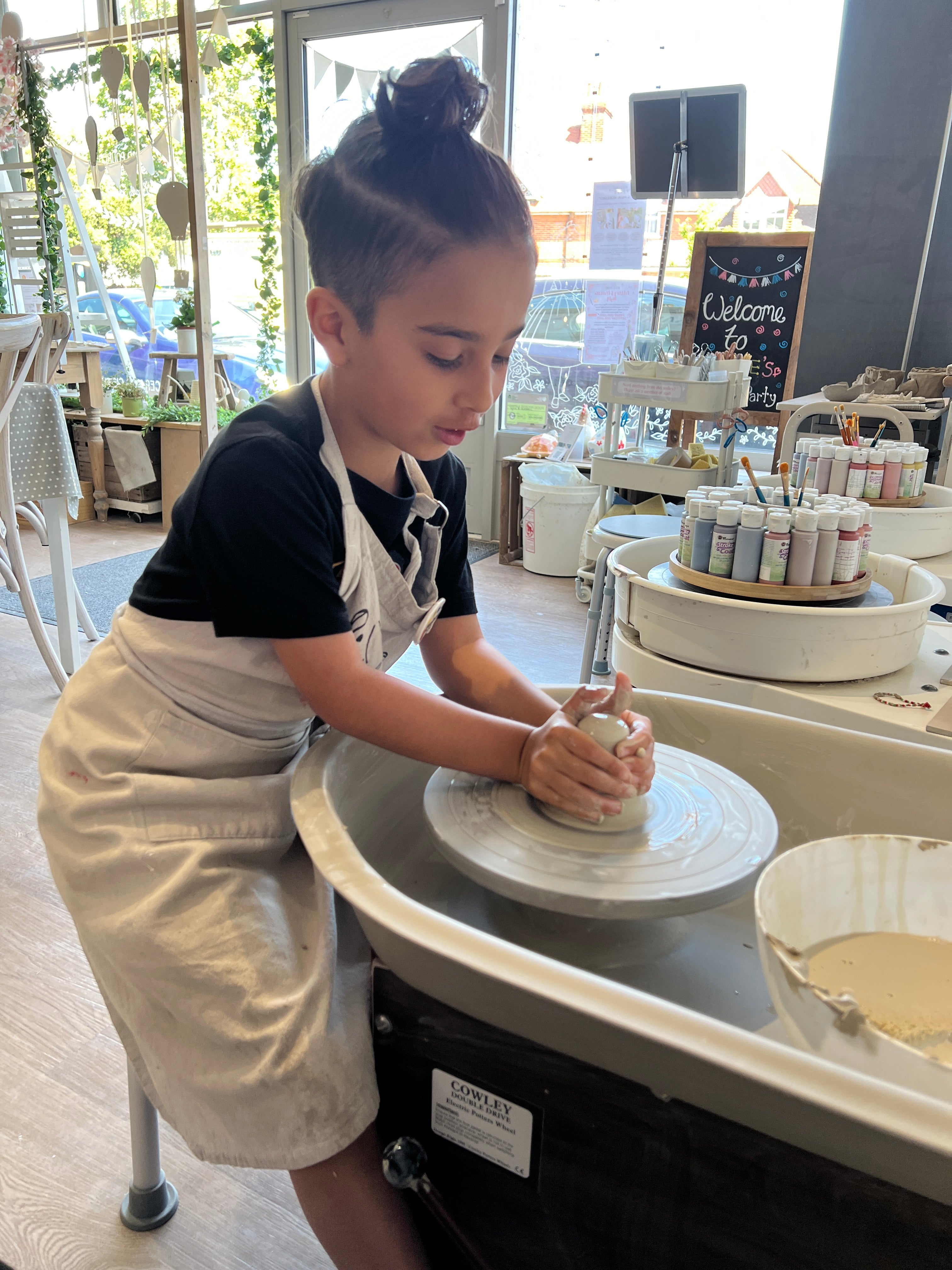 young boy wheel throwing pottery experience wick & ceramic ickenham london