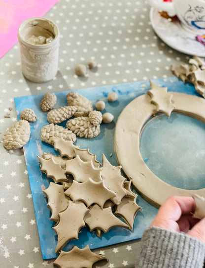 Ceramic christmas wreath making with holy leaves, pine cones and berries at wick & ceramic ickenham london
