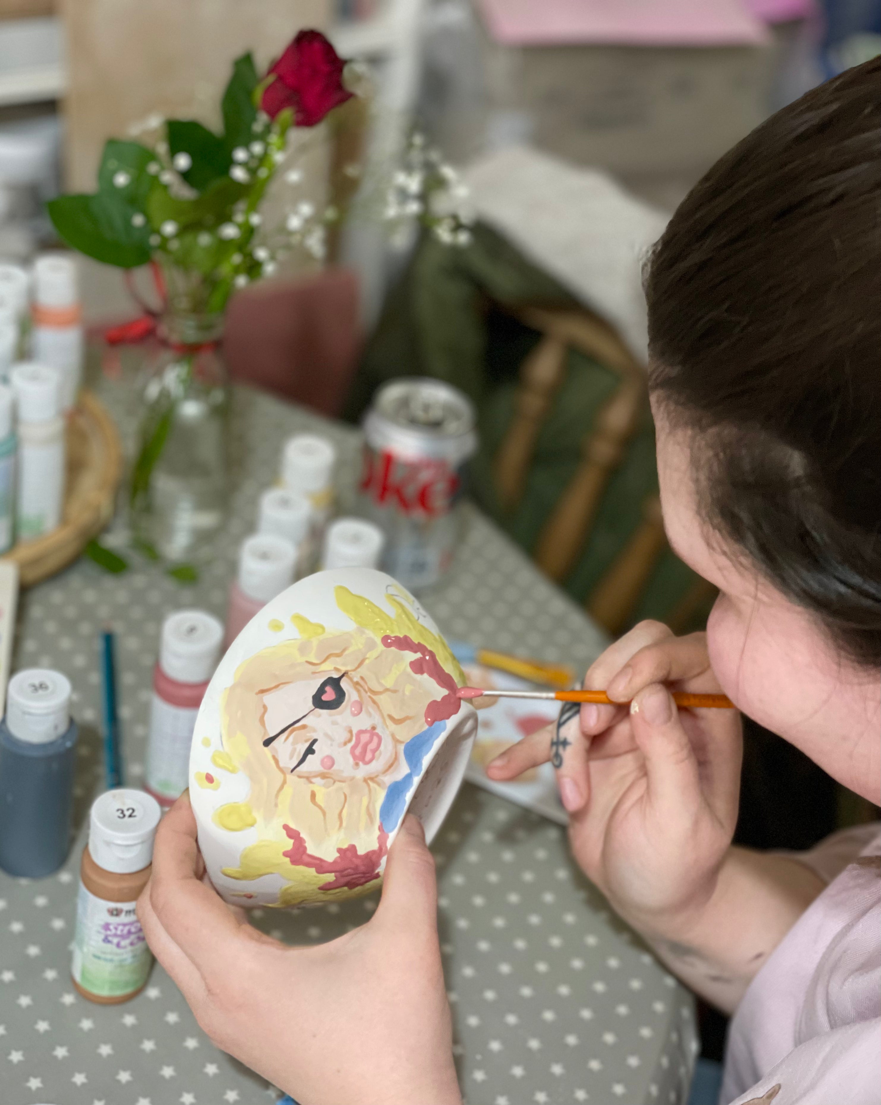 Girl pottery painting a bowl at wick and ceramic, ickenham, london