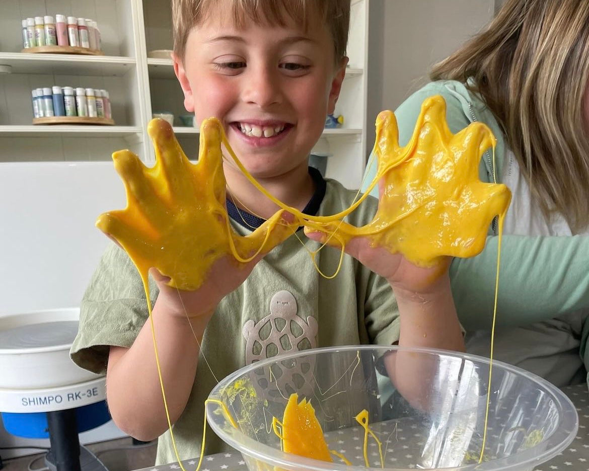 boy playing with yellow slime party sticky hands wick & ceramic ickenham london